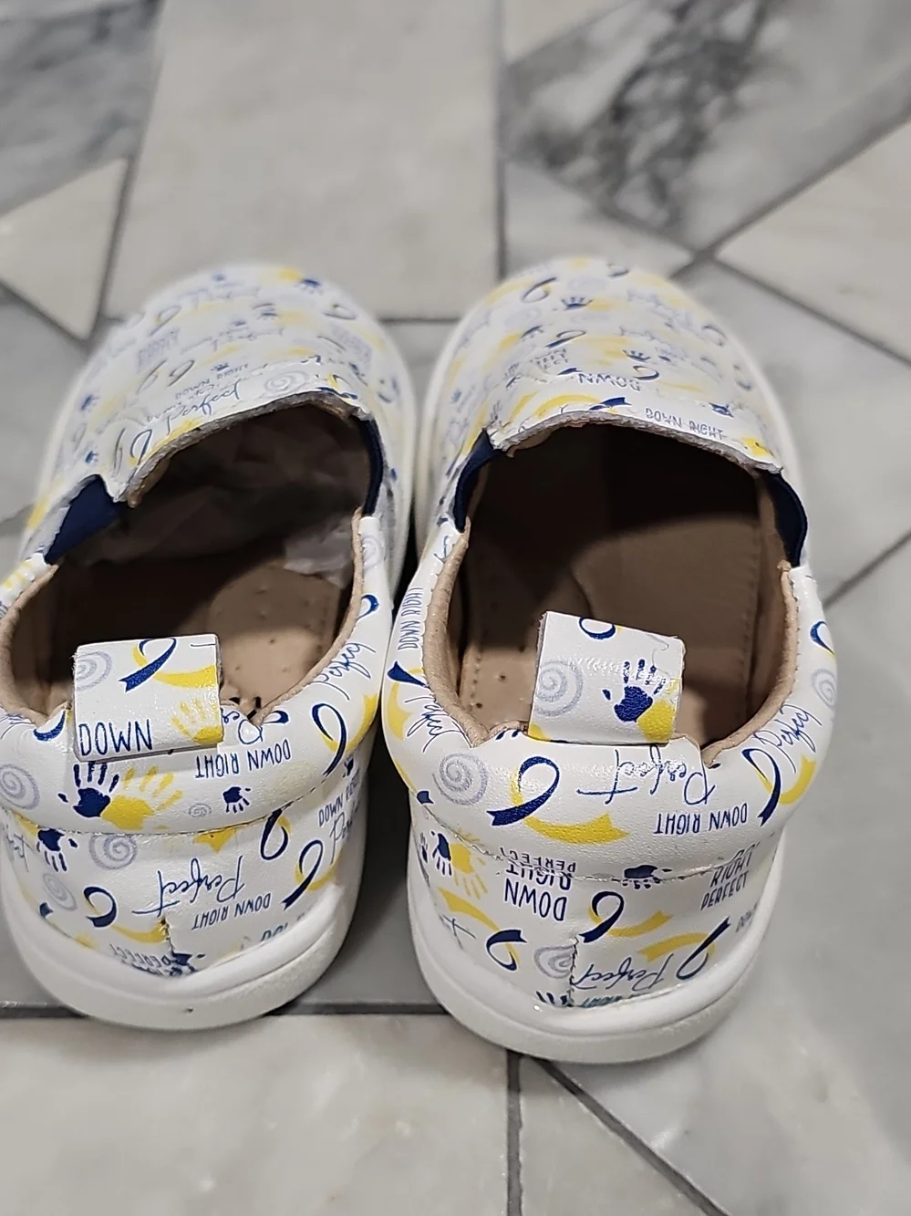 Monkey Feet White Slip-On Sneakers with Blue & Yellow Prints 12-18 Months